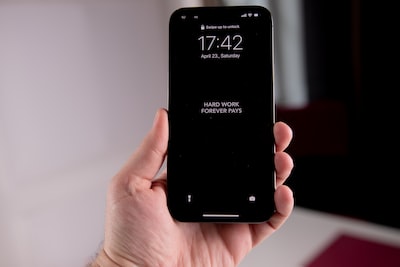 a hand holding a phone